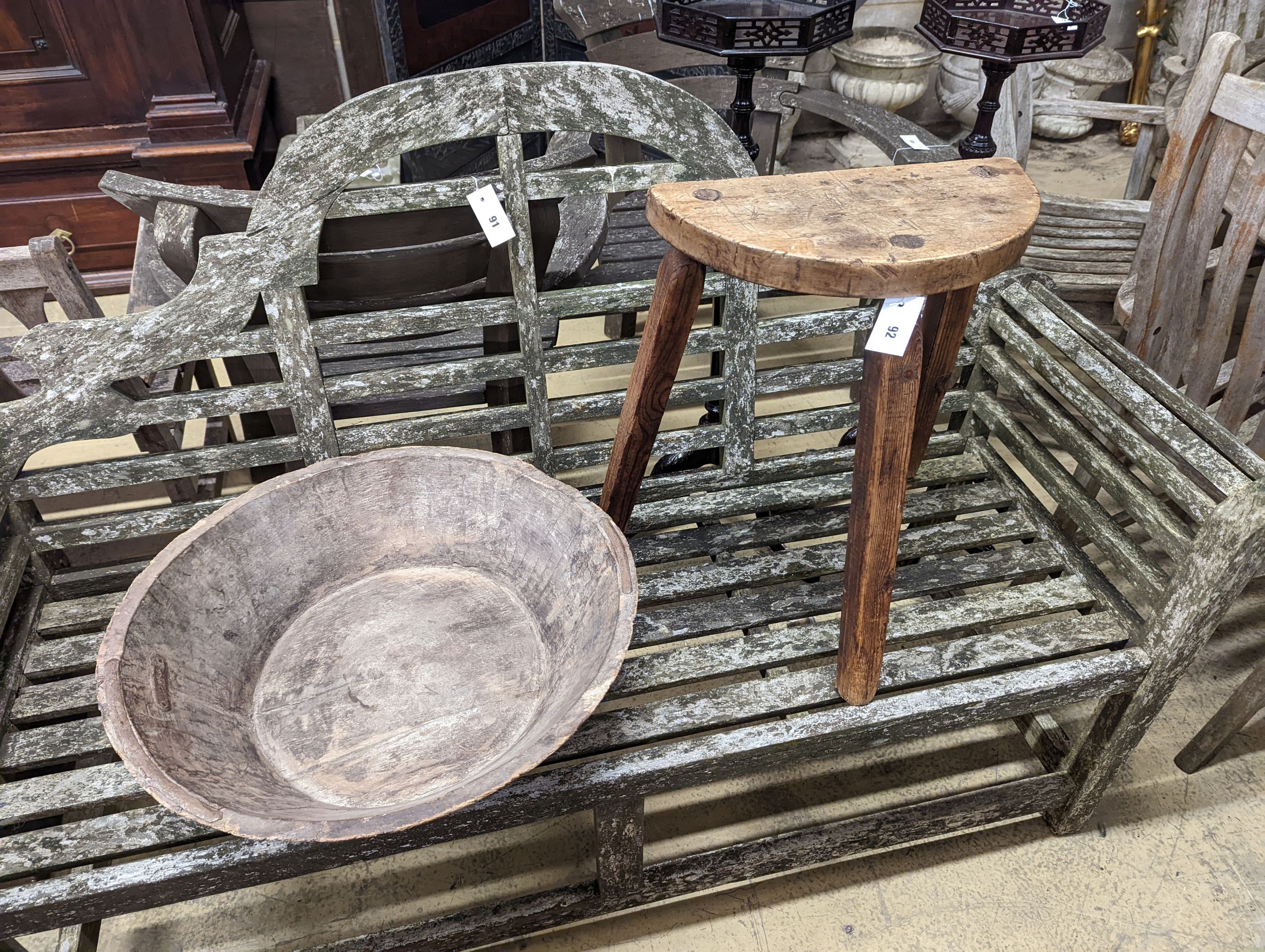 A provincial elm and fruitwood D shaped stool together with a circular iron mounted mazer.